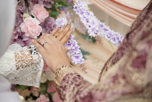 Andrika and Aliva showing their wedding rings